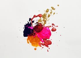 Colorful abstract paint splash on white background, capturing creative expression.